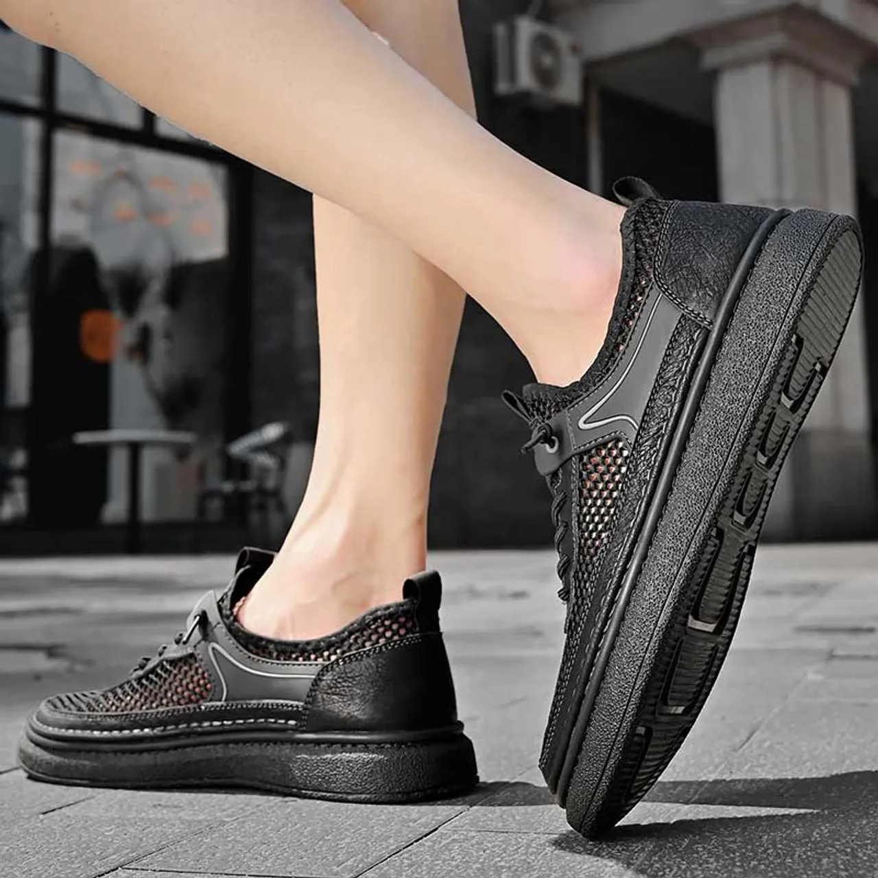 Black hollow mesh stitch accents shoe sneaker