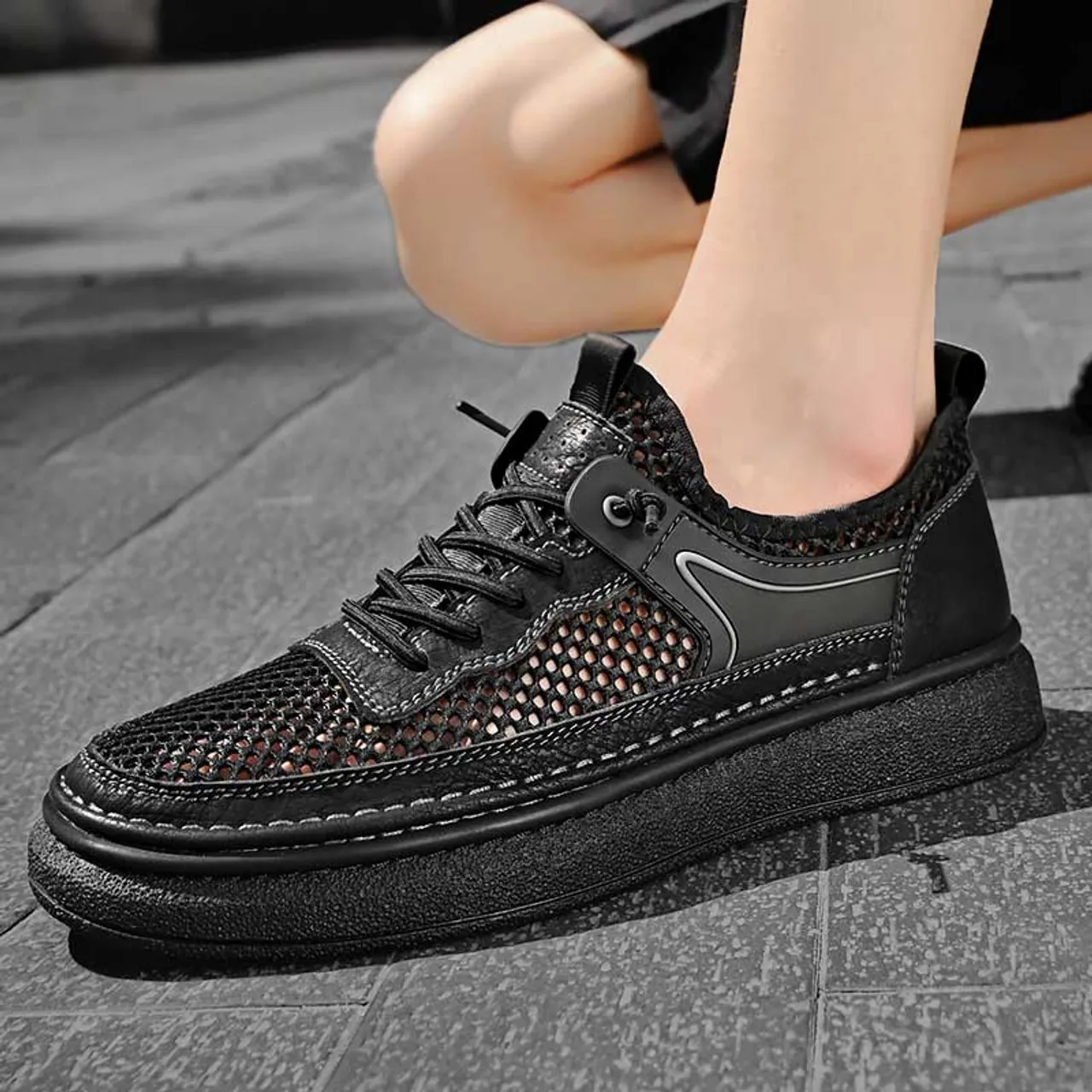 Black hollow mesh stitch accents shoe sneaker