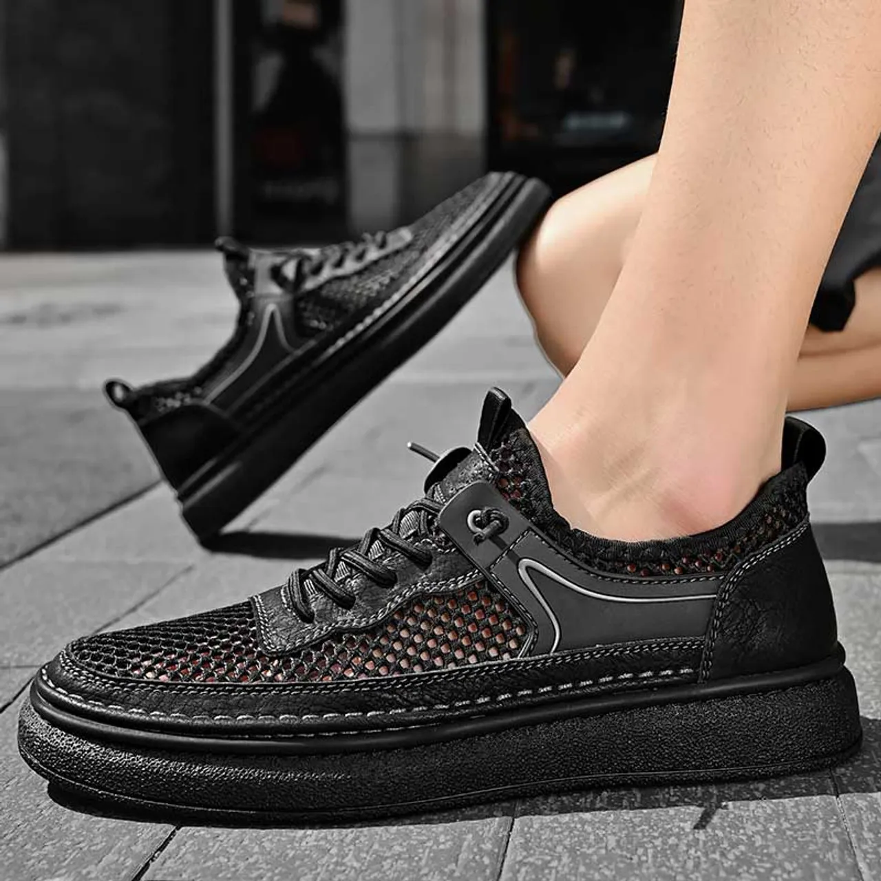 Black hollow mesh stitch accents shoe sneaker