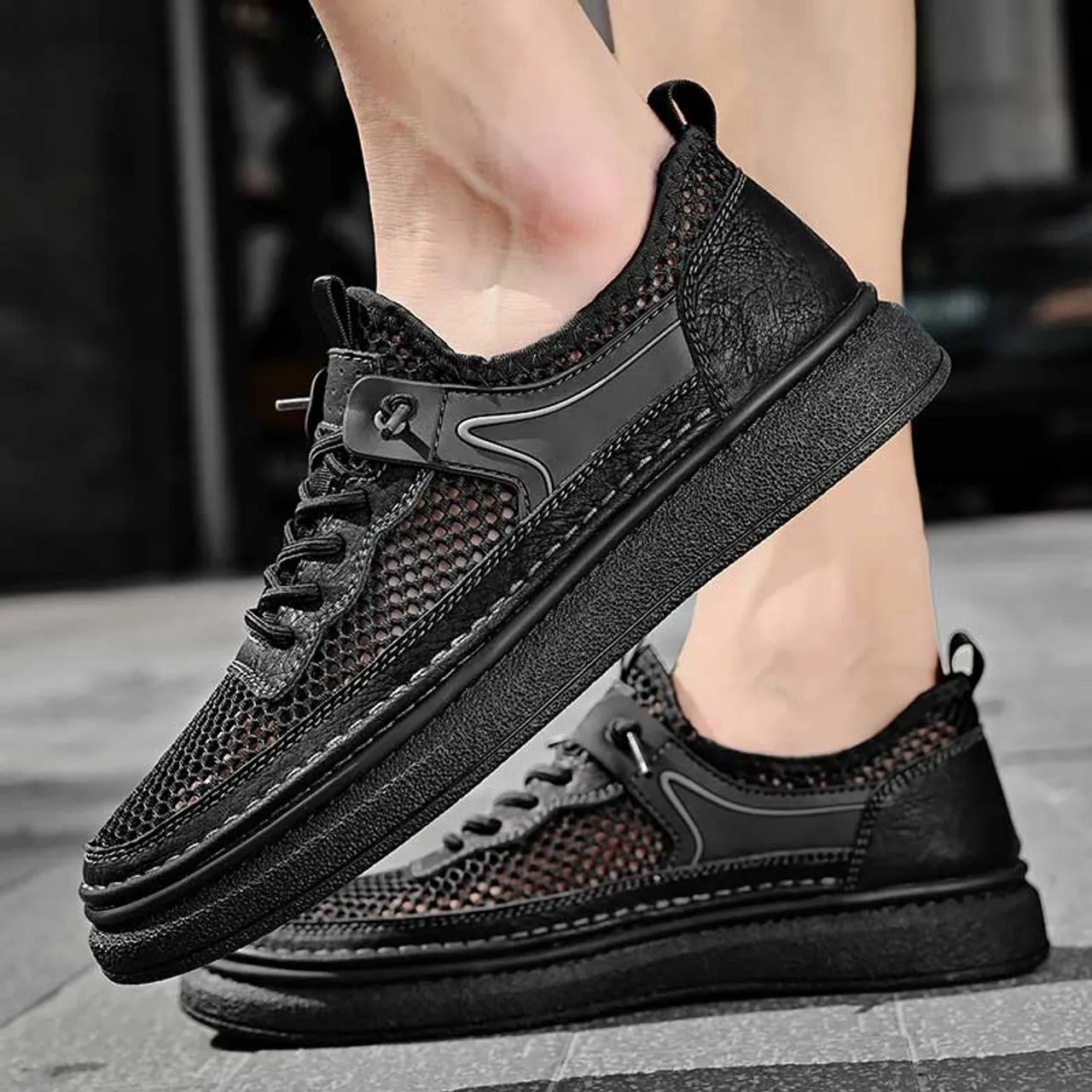 Black hollow mesh stitch accents shoe sneaker