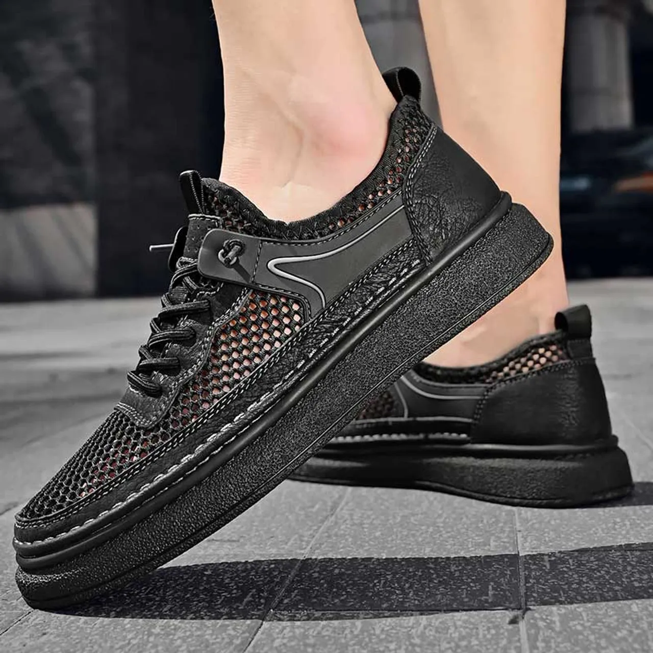 Black hollow mesh stitch accents shoe sneaker